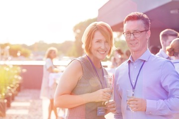 Business people on a rooftop party.
