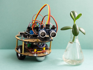 Back to school concept. A metal robot. Robotics and electronics. DIY robotics. STEM and STEAM education for kids. Free space for text.