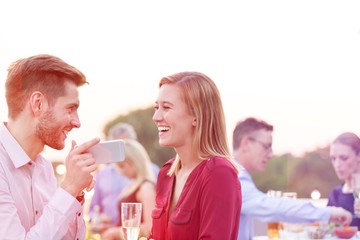 Business people on a rooftop party.