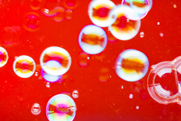 Abstract soap bubble background. Element for designers. Foam red bubble texture. Colorful bubbles float in the air