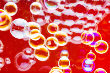 Abstract soap bubble background. Element for designers. Foam red bubble texture. Colorful bubbles float in the air