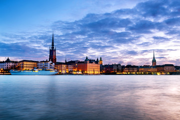 Fototapeta premium View of Gamla Stan in Stockholm, Sweden with landmarks like Riddarholm Church during the sunrise