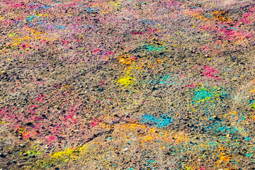 Colorful asphalt after festival of colors Holi.