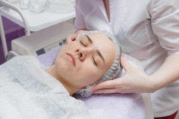 Fototapeta na wymiar woman getting ultrasound skin cleaning at beauty salon