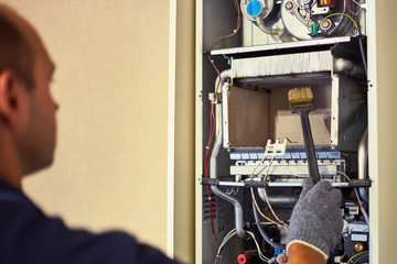Gas service master cleans the boiler from dust and soot.