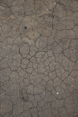 The texture of the cracks on the dry land during a drought