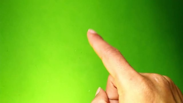 Hand gestures. Touchscreen. Men hand showing multitouch gestures in green screen