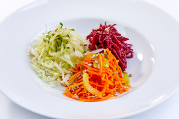 slice fresh vegetables on the white plate