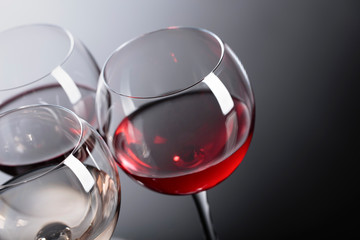 Glasses of  pink, red and white wine .