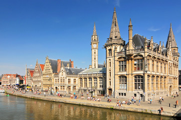 Obraz premium Picturesque medieval buildings overlooking the Graslei harbor on Leie river in Ghent town Belgium Europe.