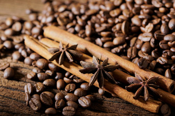 Roasted coffee beans on wooden table background
