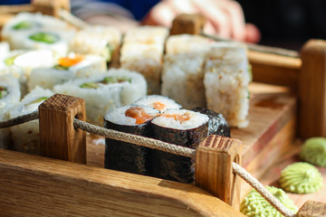 Sushi maki rolls (tuna, salmon, shrimp, avocado and other ingredients). japanese food. Top view, assorted sushi, all you can eat menu. copy space