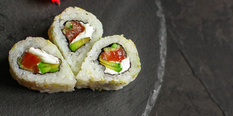 Sushi maki rolls (tuna, salmon, shrimp, avocado and other ingredients). japanese food. Top view, assorted sushi, all you can eat menu. copy space