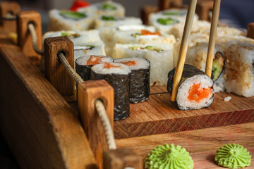 Sushi maki rolls (tuna, salmon, shrimp, avocado and other ingredients). japanese food. Top view, assorted sushi, all you can eat menu. copy space