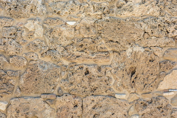 Alte Mauer aus historischen Steinen als Steintextur