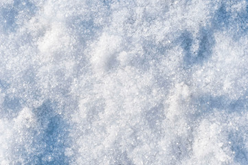 the first snow, the texture of the snow, snow abstract background with blue tint