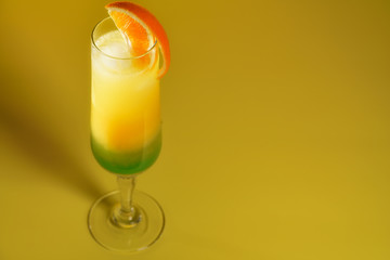 Moscow Lights cocktail in a champagne glass garnished with an orange slice