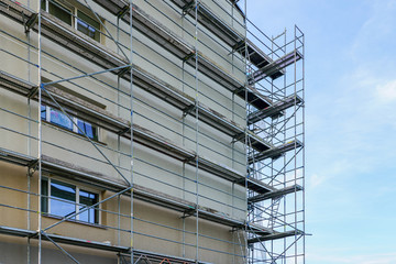 scaffolding before installation of the thermal insulation of the facade