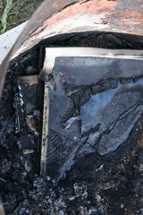 beach sand. bright sun. the monitor burns with smoke. have a keyboard.