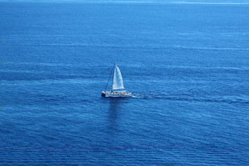 white romantic sailboat sailing on the beautiful blue water of the Mediterranean Sea