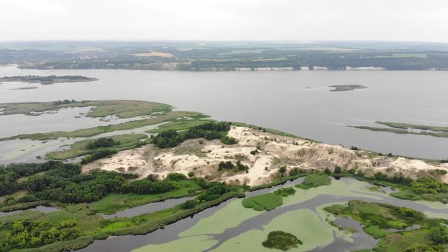 Aerial view. Wild nature. Dniper river and wetlands near Kyiv, Ukraine.  4K
