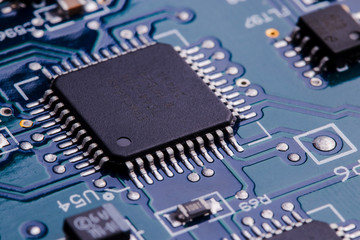 Selective focus of computer motherboard chip and other details.