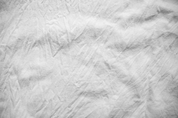 texture background cotton folds of white fabric
