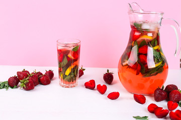 Strawberry mojito cocktail on pink background