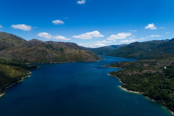 Fototapeta na wymiar Aerial scenic view of the lake at the Vilarinho das Furnas Dam, Peneda Geres National Park, in Portugal.