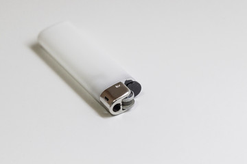 Close-up shoot of white color of lighter horizontal positioned with perspective angle