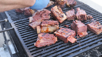 Barbecue assorted delicious fatty organic marinated meat on the bone of beef lamb, pork, cooked on the coals