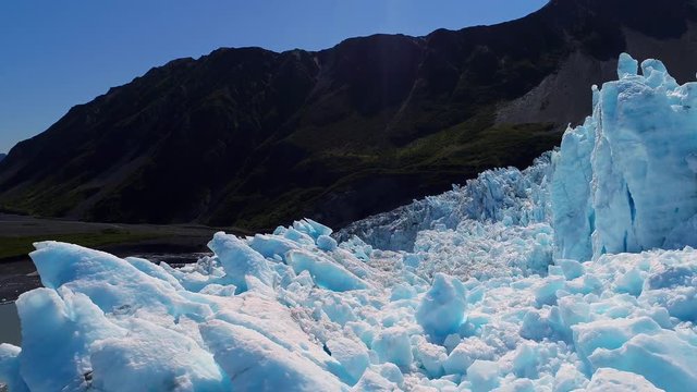 Aerial of glacier blue ice in Alaska. Aialik
