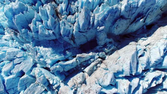 Aerial view from above of ice formations on a glacier