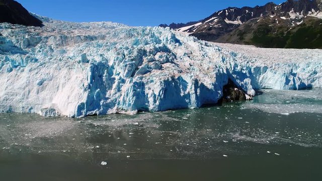 Aerial of large Alaska Glacier in the middle of nature. Aialik