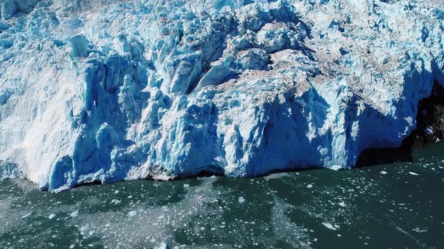 Aerial timelapse of glacier melting into the sea