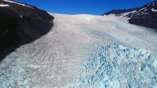 Aerial of a large glacier in between two mountains