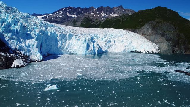 Aerial of a glacier ending in the sea in Alaska. Sea ice iceberg Aialik