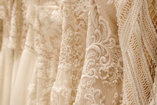 Cream Wedding Dresses Hanging On The Rack