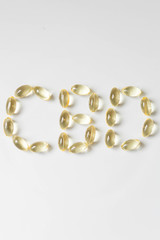CBD Pills, Word CBD Written Out with Pills, Edibles