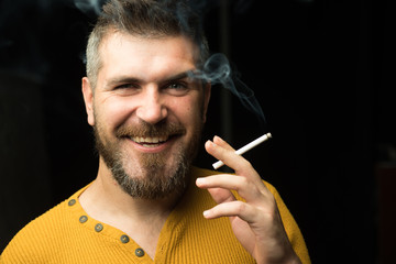 bad habit. brutal bearded hipster. drugs. health. cool man. man with beard. man with cigarette in...