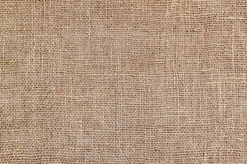 Rural texture of sackcloth. Background of very coarse, rough fabric woven made of flax, jute or hemp. Burlap bag material. Design element. Sacking and bagging  pattern.