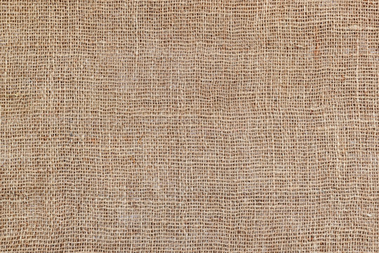 Rural texture of sackcloth. Background of very coarse, rough fabric woven made of flax, jute or hemp. Burlap bag material. Design element. Sacking and bagging  pattern.