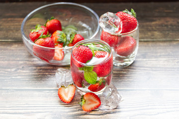 fresh Strawberry mojto cocktail with ice and mint in glass fruit to make water in the summer.