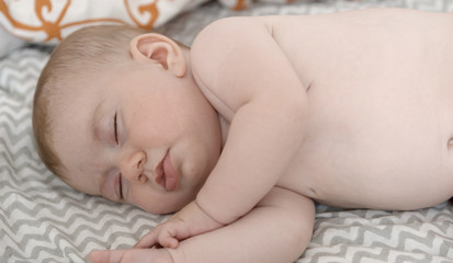 small baby girl on a bed