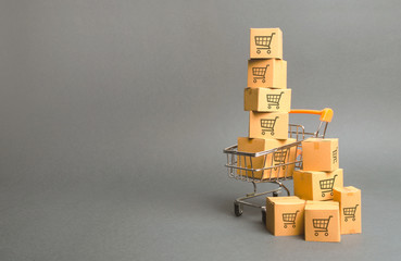 Shopping cart and boxes with drawing of smaller carts. goods sale. commerce, online shopping....