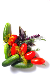 Corner from the tomatoes, cucumbers and spices isolated on the white background