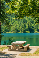 A picnic table with gorgeous view at Lake Of The Woods, British Columbia, Canada.