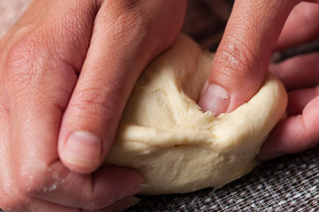 Woman making dought.Dought for pizza and bread.Food