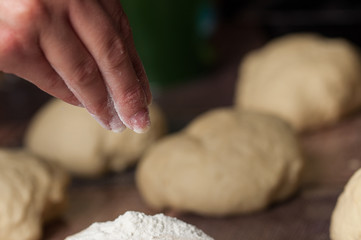 Woman making dought.Dought for pizza and bread.Food