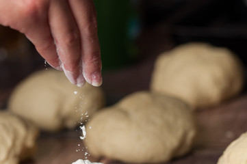 Woman making dought.Dought for pizza and bread.Food